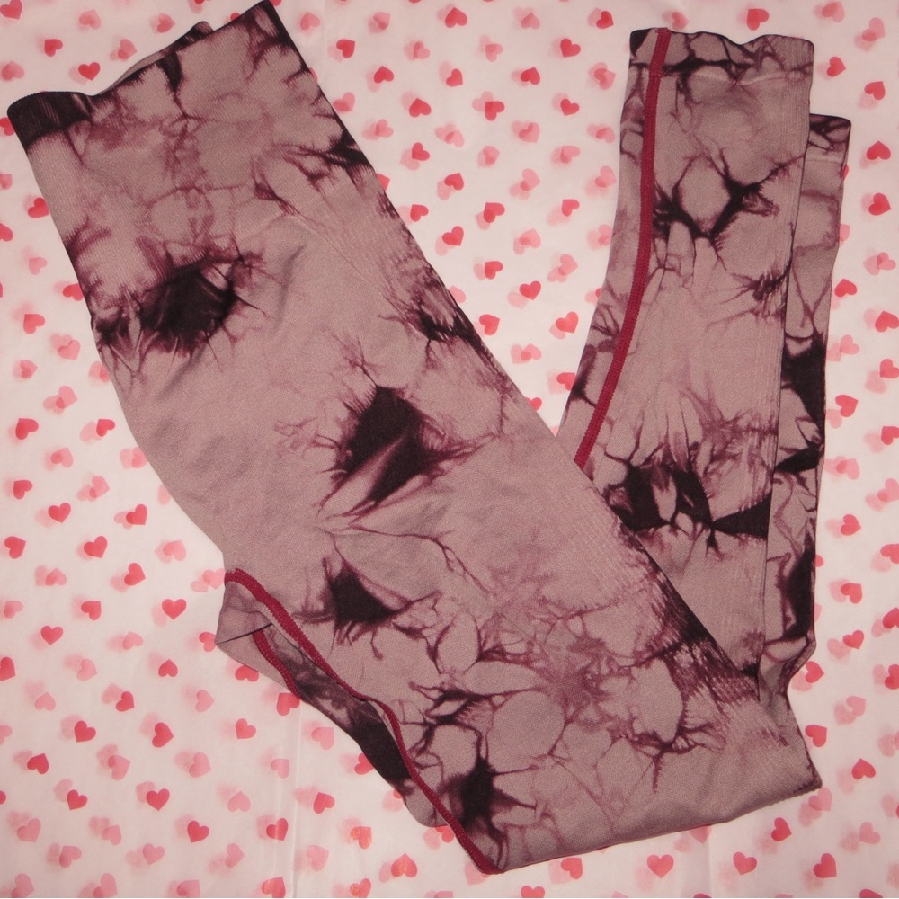 Red & black tie-dye leggings with red trim.